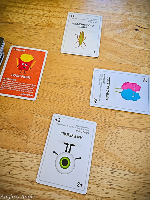 Close-up of Taco vs Burrito card game food cards and action cards