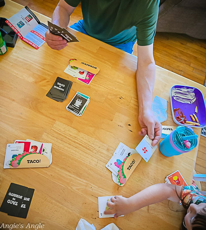 Taco vs Burrito game cards spread out on a table during play (1)