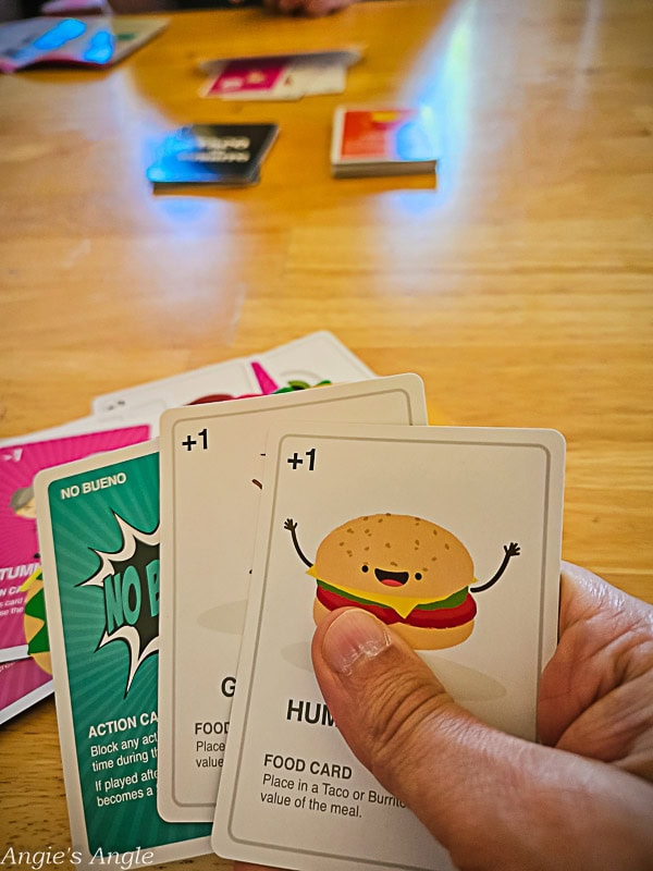 Taco vs Burrito game cards spread out on a table during play (2)
